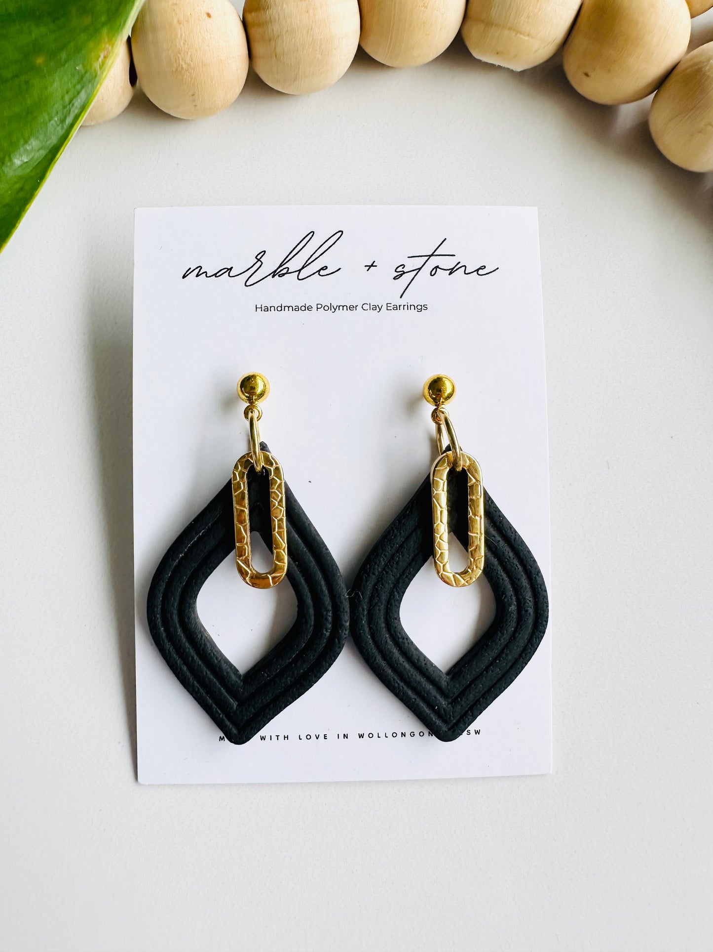 Black and gold dangle earring
