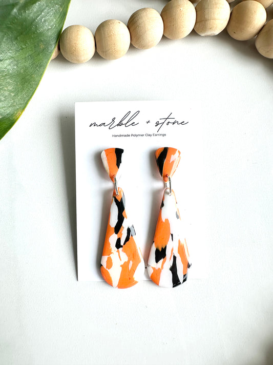 Orange, black and white drop