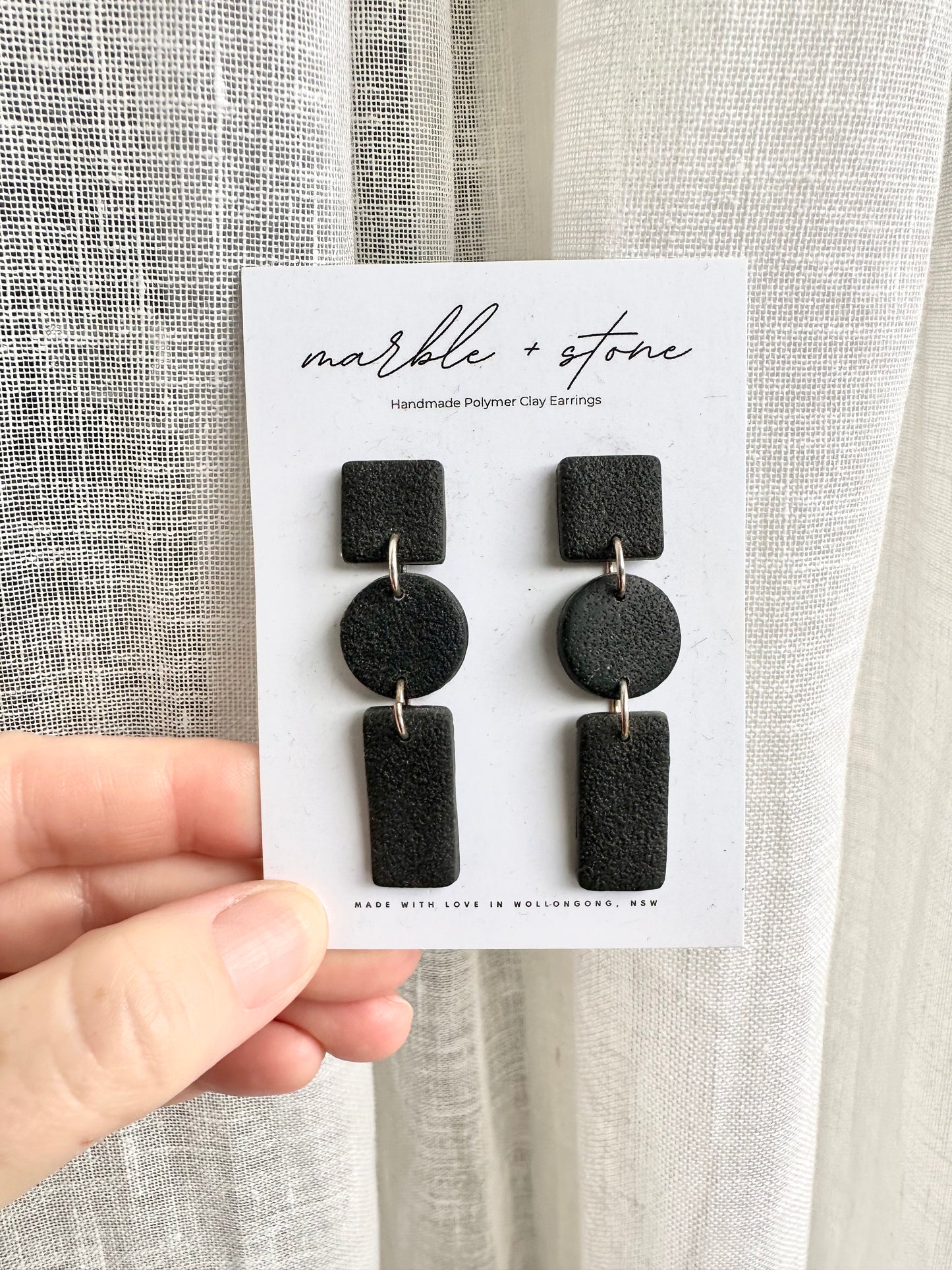 Mini shapes in a black drop earring